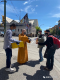 Master Shi Xing Wu distributes food and water to street homeless during the Bathing Buddha Festival